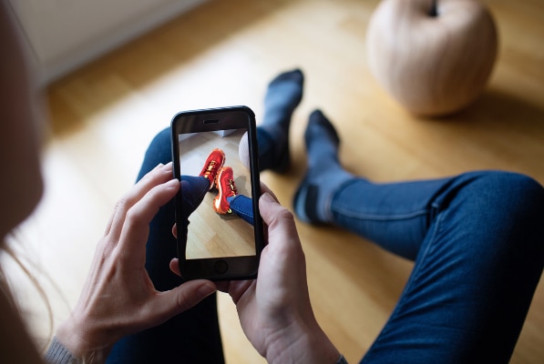 “Augmented Reality ensures virtual try-on.” Image and alt text by Scanblue. Original image located here: https://scanblue.com/en/augmented-reality-and-shoes-2/