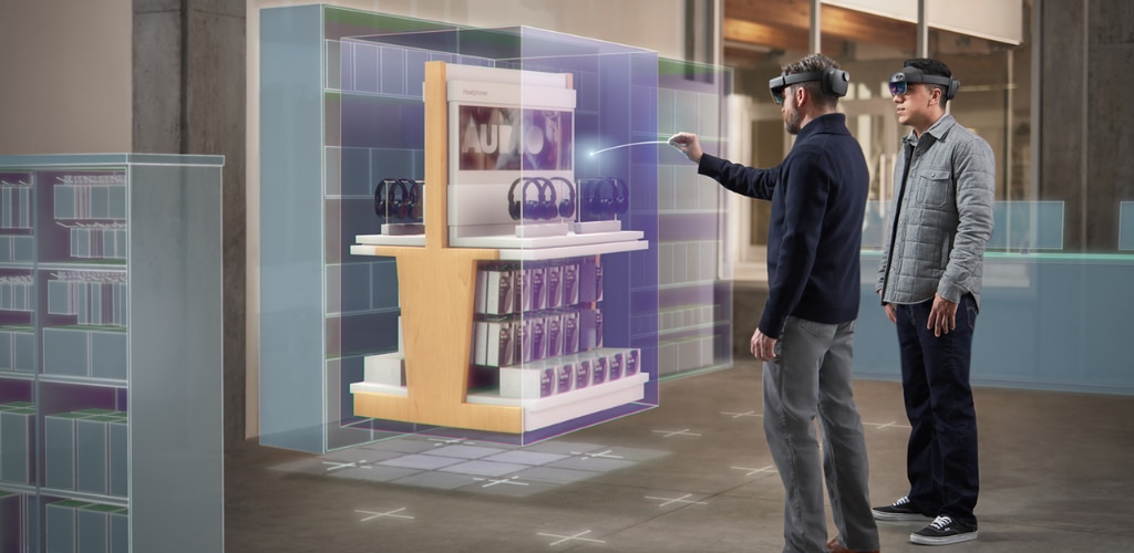 “Point and commit with hands on HoloLens 2.” Image and alt text by Microsoft. Original image located here: https://learn.microsoft.com/en-us/windows/mixed-reality/discover/mixed-reality
