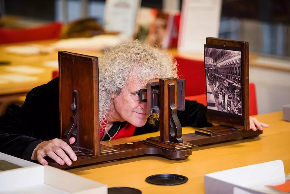 Dr. Brian May peering through on of Charles Wheatstone’s stereoscope. Image by King’s College London. Original image located here: https://www.kcl.ac.uk/charles-wheatstone-the-father-of-3d-and-virtual-reality-technology-2