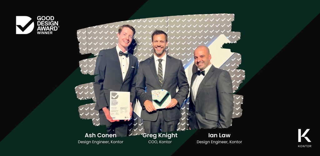 Members of the Kontor team accept the Good Design Award at the 2023 Good Design Awards ceremony in Sydney, Australia. Person on the left is Ash Cohen, Design Engineer, Kontor; in the middle is Greg Knight, Coo, Kontor; on the right is Ian Law, Design Engineer, Kontor. On the top left is the Good Design Award Winner logo. On the bottom right is the Kontor logo. In the middle is a green Kontor watermark.